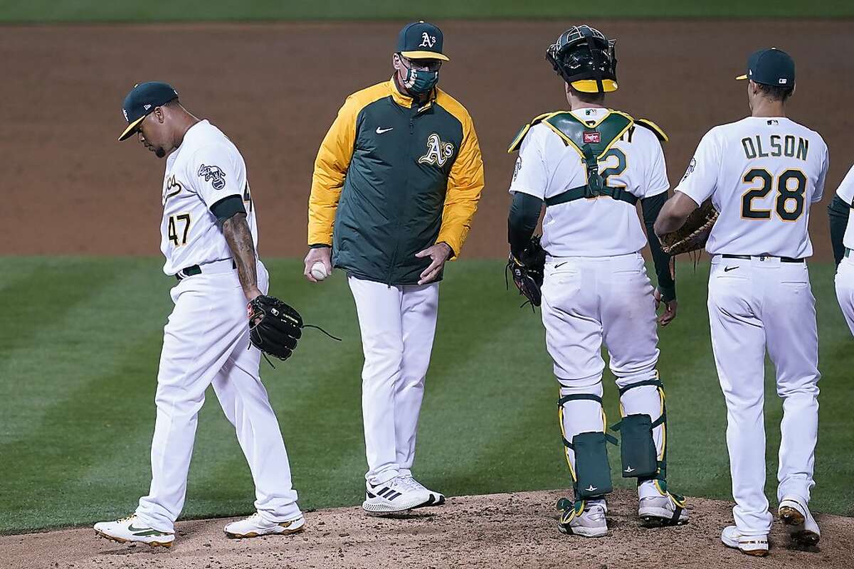 A’s starting pitcher Frankie Montas walks off the mound after being taken out by manager Bob Melvin in the third inning.