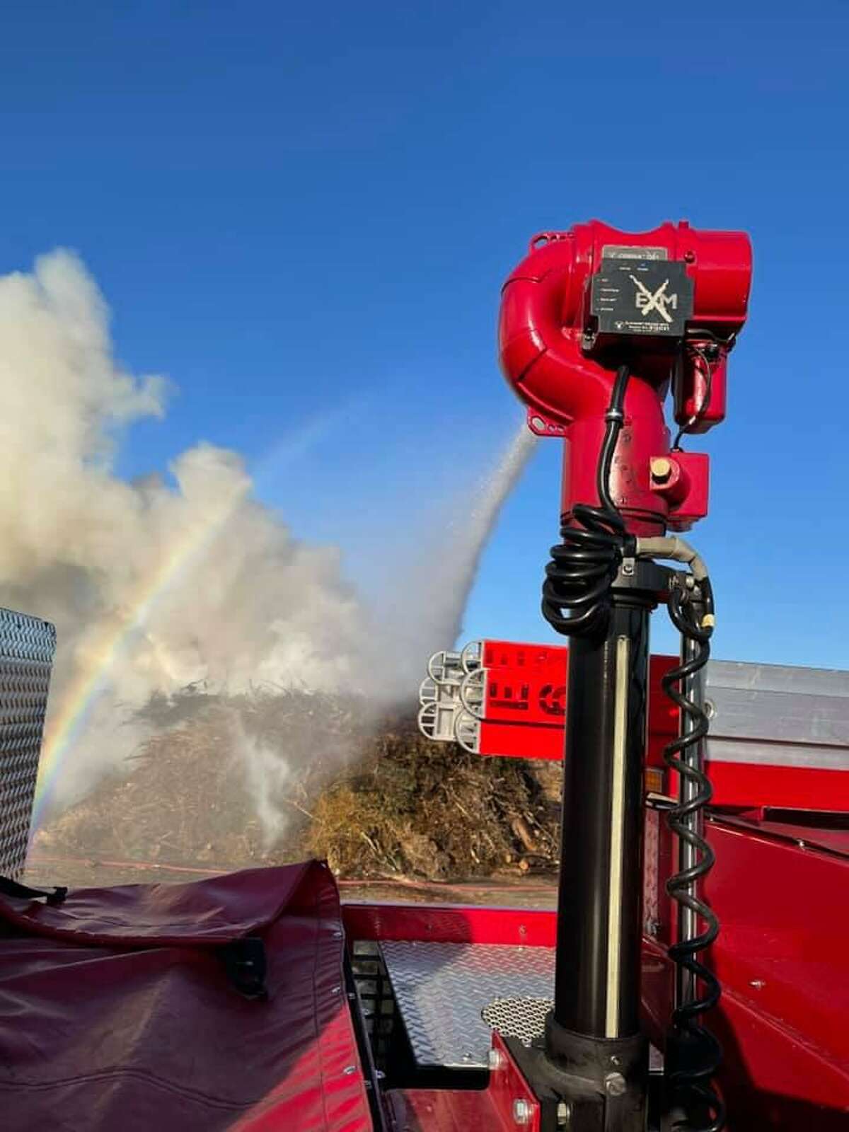 Crews battle a mulch fire in Ansonia, Conn., on Monday, April 5, 2021.