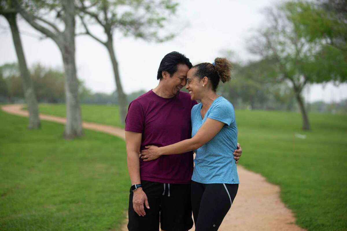 Active runner Ganesa and Quan Collins pose for a photograph on their usual running trail Saturday, March 27, 2021, at Independence Park in Pearland. Last July, the couple were on this route, when Quan, 50, blacked out and fell over with a cardiac arrest. Luckily, Ganesa, 48, was trained to perform CPR and ended up saving his life.