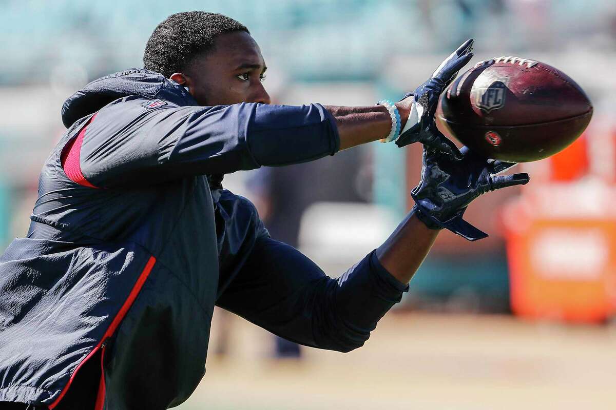 Houston Texans defensive back Andre Hal catches a football before an NFL football game against the Jacksonville Jaguars at TIAA Bank Field on Sunday, Oct. 21, 2018, in Jacksonville. Hal was reactivated to the Texans roster after returning to team from cancer treatment.