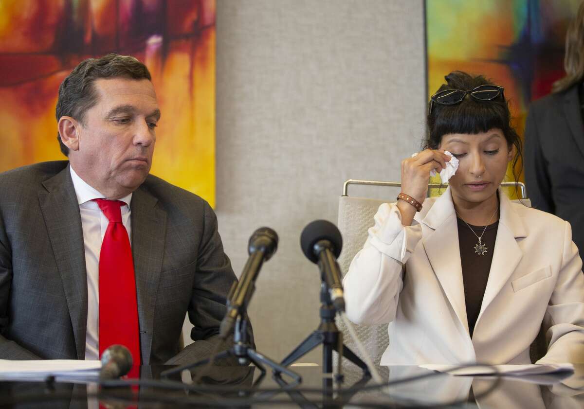 Ashley Solis, the first accusor of the sexual assault allegations against Houston Texans quarterback Deshaun Watson, wipes away tears while giving her statement during a news conference Tuesday, April 6, 2021, in Houston.