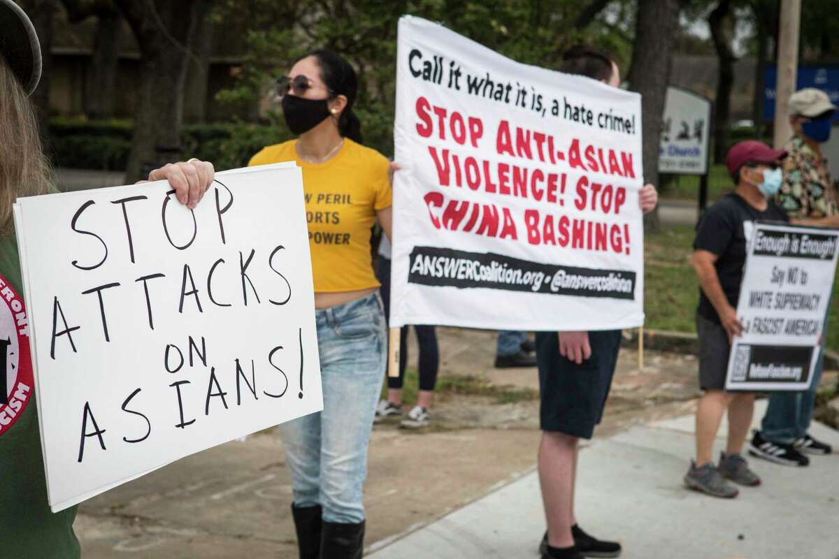 Demonstrators gather for a rally for a National Day of Action demanding an end to hate crimes targeting Asian American communities Saturday, March 27, 2021 in Houston.