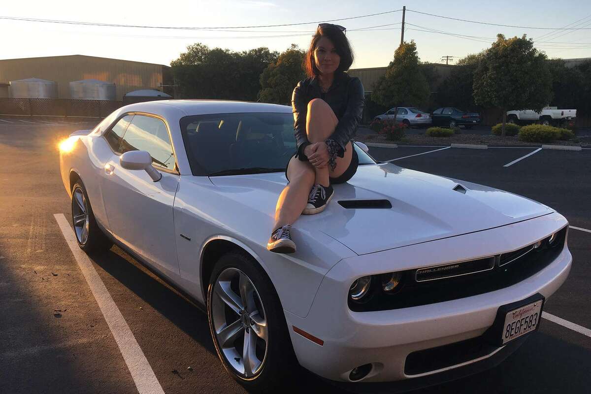Writer Charlotte Bailey on her rented Dodge Charger.