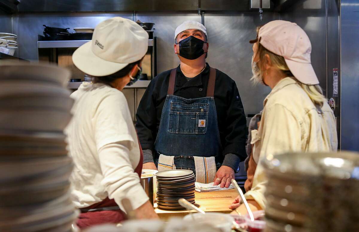 Stephanie Reagor, left, a co-partner, head cook Omar Aviles, and Emma Lipp, also a co-partner, work in the kitchen during the dinner shift at Valley Bar & Bottle, a new wine shop, bar, and restaurant, on Friday, March 12, 2021, in Sonoma, Calif.