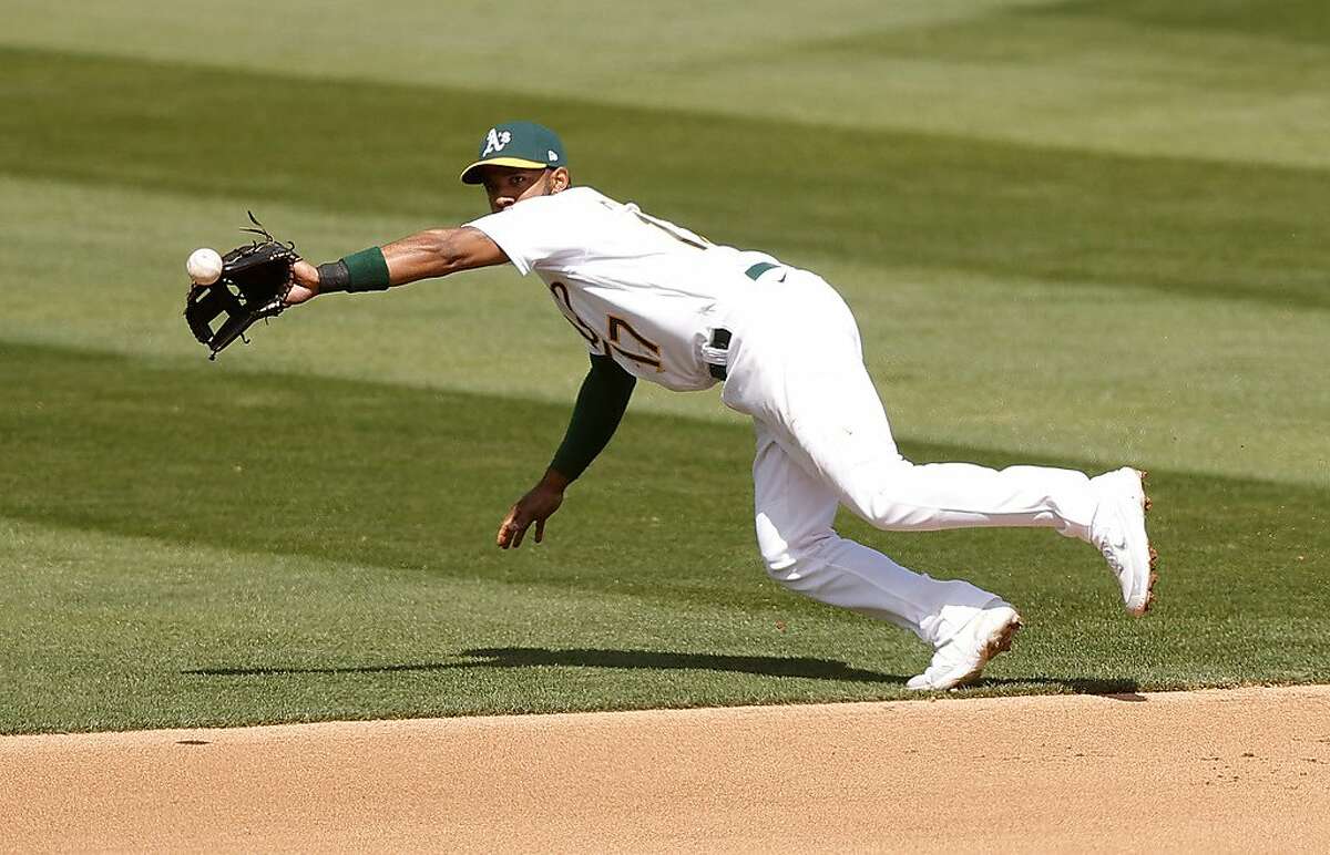 OAKLAND, CALIFORNIA - APRIL 03: Elvis Andrus #17 of the Oakland Athletics makes a play on a ball hit by Martin Maldonado #15 of the Houston Astros in the fourth inning at RingCentral Coliseum on April 03, 2021 in Oakland, California. (Photo by Ezra Shaw/Getty Images)