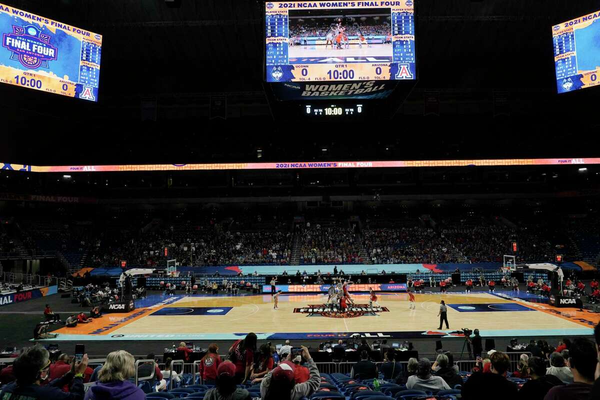 Players get set for the opening tipoff during the first half of a women's Final Four NCAA college basketball tournament semifinal game between Connecticut and Arizona Friday, April 2, 2021, at the Alamodome in San Antonio. (AP Photo/Morry Gash)