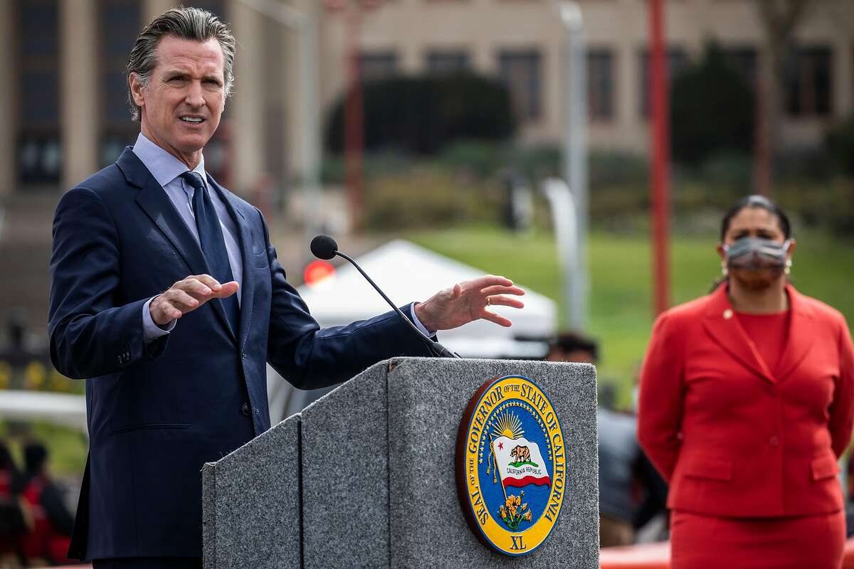 California Governor Gavin Newsom speaks during a press conference at the COVID-19 mass vaccination site at City College of San Francisco in San Francisco, California Tuesday, April 6, 2021. Newsom announced that California will retire its color-coded pandemic blueprint on June 15 and allow almost all sectors of the economy, in all 58 counties, to reopen at or near full capacity, state officials said Tuesday. However, the mask mandate will stay in effect to protect those who have not yet been able to be vaccinated against the coronavirus.