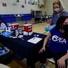 Darien Superintendent of Schools Alan Addley and Darien teachers' union president, Joslyn Delancey, get vaccinated against the coronavirus March 6, at Town Hall in Darien.
