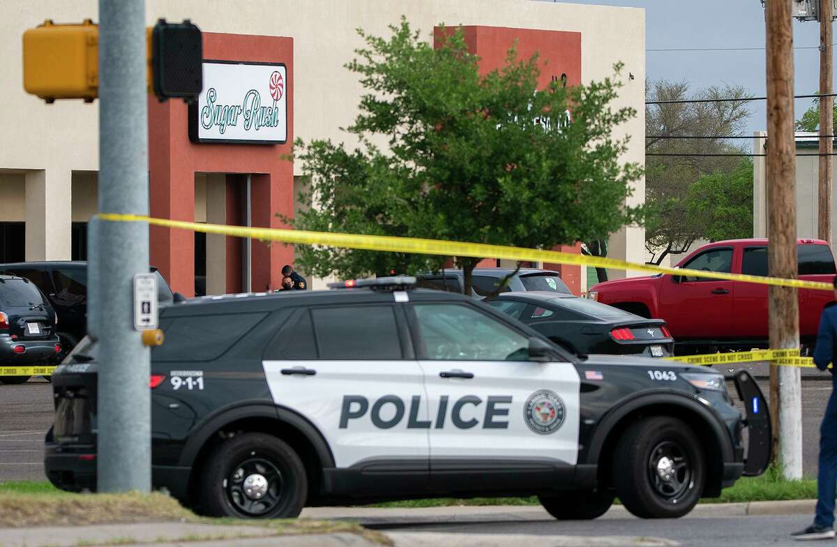 Laredo Police assess the crime scene outside Sugar Rush Partyland, Monday, April 5, 2021, at the 4500 block of McPherson Road. One man died and five others were injured by stabbing while shots were also fired.