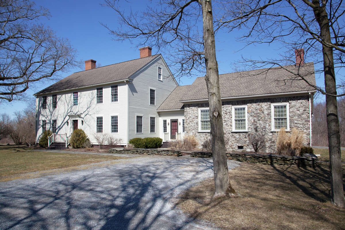 3307 County Route 21, Kinderhook. This week’s house is a classic wood clapboard Colonial with a field stone addition. It was built in 1995 on 56 acres. The lot also has on it a barn, a 3-bay carriage house and a cottage. The house has 5,216 square feet of living space. It has four bedrooms and four bathrooms, plus an additional bedroom and bathroom in the guest house. There are six wood-burning fireplaces, a screened porch, a bar in the walk-out basement and a pond lined with willows. Private well and septic, oil heat. Ichabod Crane schools. Taxes: $35,000. List price: $1,995,000. Contact listing agent Mary Stapleton with Berkshire Hathaway HomeServices Blake, Realtors at 518-929-7783.