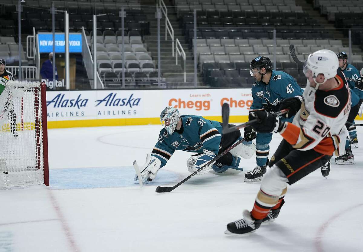 Anaheim left wing Nicolas Deslauriers (right) gets the puck past Sharks goaltender Martin Jones during the second period, when the Ducks scored three times in their win.