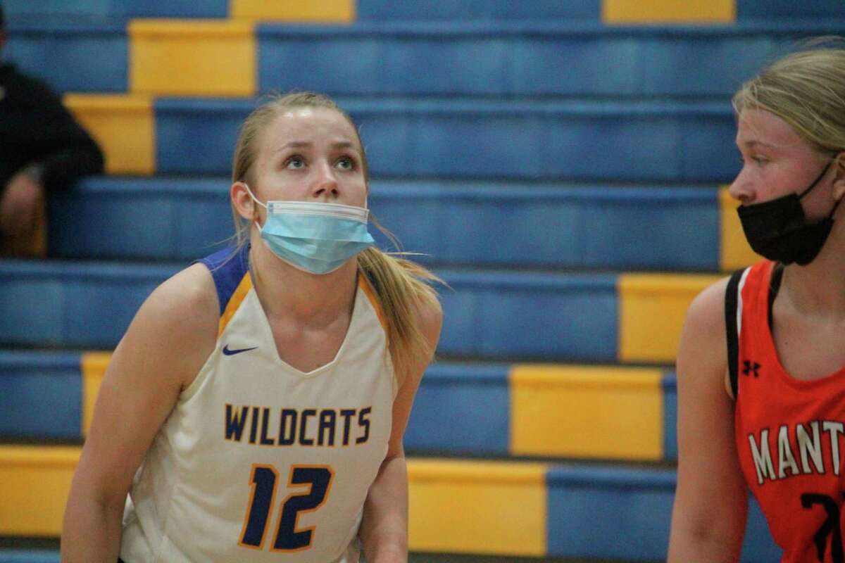Kara Henry gets ready to make a play for Evart in recent action. (Pioneer photo/John Raffel)