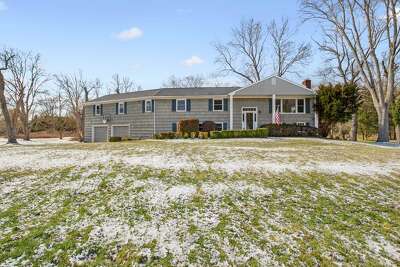 Gray shingle raised ranch at 7 Tiffany Lane, Westport.