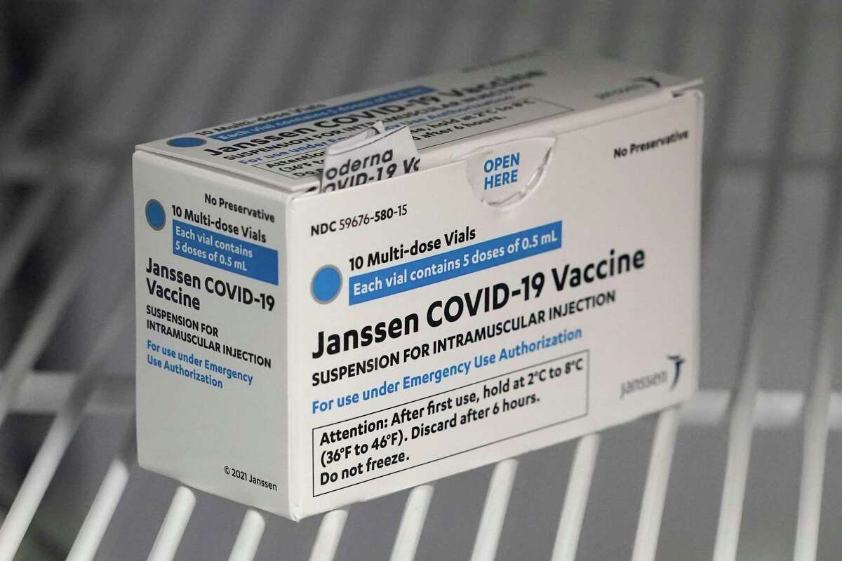 FILE - In this March 25, 2021 file photo, a box of the Johnson & Johnson COVID-19 vaccine is shown in a refrigerator at a clinic in Washington state.