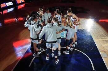 SAN ANTONIO, TEXAS - APRIL 02: The UConn Huskies huddle up during intros prior to the first quarter against the Arizona Wildcats in the Final Four semifinal game of the 2021 NCAA Women's Basketball Tournament at the Alamodome on April 02, 2021 in San Antonio, Texas. (Photo by Carmen Mandato/Getty Images)