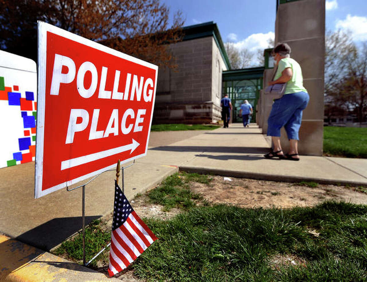 Voters head to the polls at the Edwardsville Public Library Tuesday. Madison County Clerk Debra Ming-Mendoza said Tuesday night it was a relatively normal election, though turnout was low.