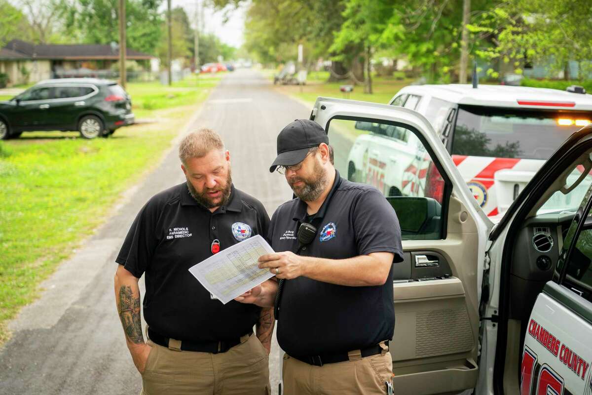 Chambers County paramedics Ronald Nichols and Danny Burke plan Burke's day administering Moderna COVID-19 vaccines, Tuesday, April 6, 2021, in Winnie, TX. The Chambers County ambulance service has been administering vaccines to people in their homes.