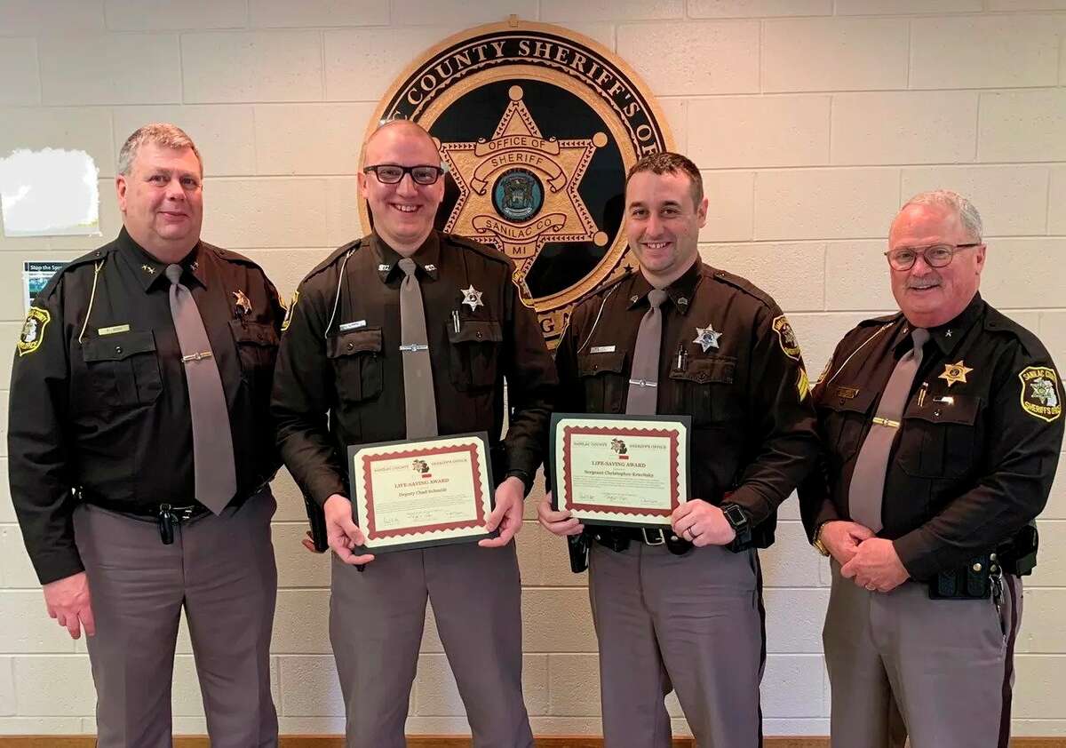 From left, Sanilac County Sheriff Paul Rich, Dept. Chad Schmidt, Dept. Christopher Kravitsky, and Undersheriff Tim Torp as the two deputies receive Commendation for Life Saving awards. Schmidt had received two of these awards in the space of a week. (Sanilac County Sheriff's Office/Courtesy Photo)