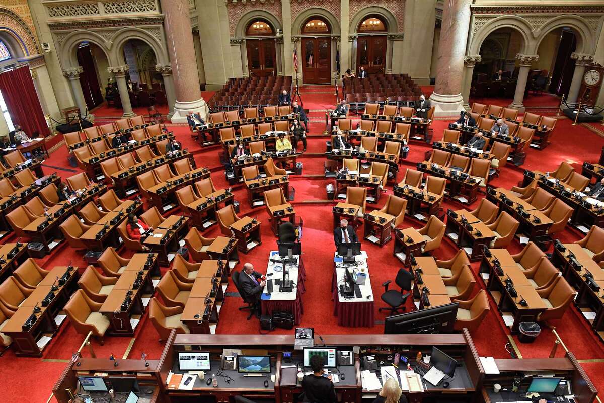 Assembly members vote on the new state budget deal at the Capitol on Wednesday, April 7, 2021 in Albany, N.Y. A three-way deal was reached between the Senate, Assembly and governor on how to spend $212 billion of public money for next year. (Lori Van Buren/Times Union)