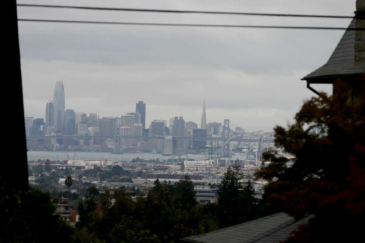 The San Francisco skyline is seen as dark cloudy skies hang over much of the Bay Area in this view from Piedmont, Calif., on Thursday, Oct. 19, 2017.