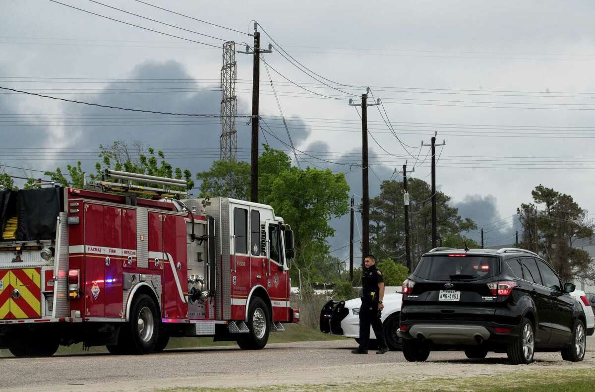 A Harris County Sheriff's Office deputy blocks Market Street, near Appelt Drive, as firefighters battled a fire at a chemical storage facility on the 1000 block of Lakeside Drive, on Wednesday, April 7, 2021, in Channelview.