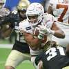 Roschon Johnson, running against Colorado in the Alamo Bowl, will remain a running back for new coach Steve Sarkisian.