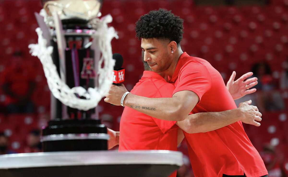 UH basketball coach Kelvin Sampson hugs junior Quentin Grimes during a celebration of the men's basketball team's run to the 2021 Final Four at the Fertitta Center in Houston on Wednesday, April 7, 2021.