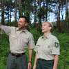 Wes Moorehead, Texas A& Forest Service East Texas Operations Department Head, and Kristi Keach, USDA Forest Service Timber Resource Specialist, survey a timber stand at the Sabine National Forest on June 24, 2019.