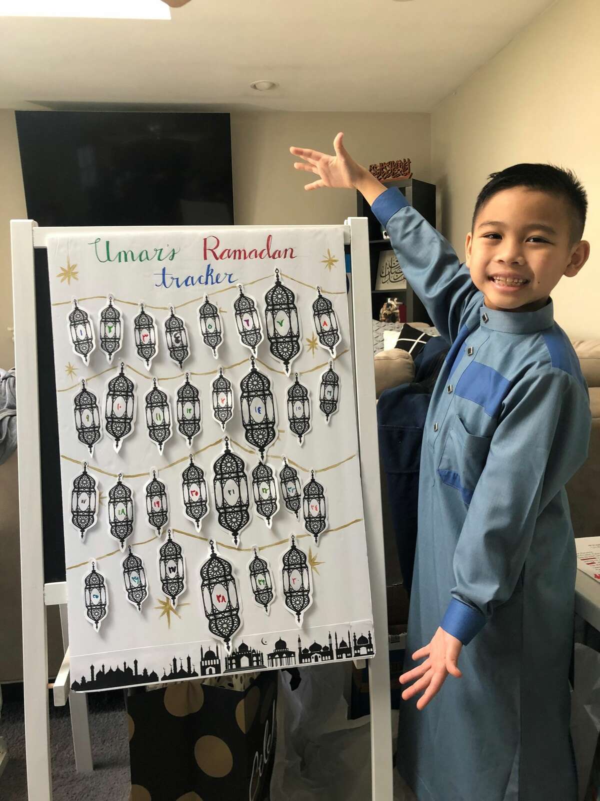 Umar Diep, 9, of Colonie displays his Ramadan tracker, where he adds a lantern for each day he fasts.