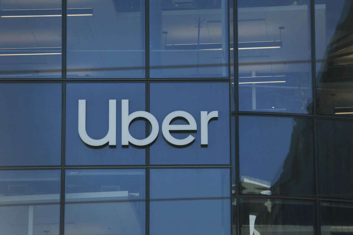 Uber signage is seen on one of the buildings in San Francisco, Calif. The unmasked woman caught on video coughing and striking her Uber driver has pleaded not guilty to multiple charges, the San Francisco District Attorney’s Office confirmed Wednesday.