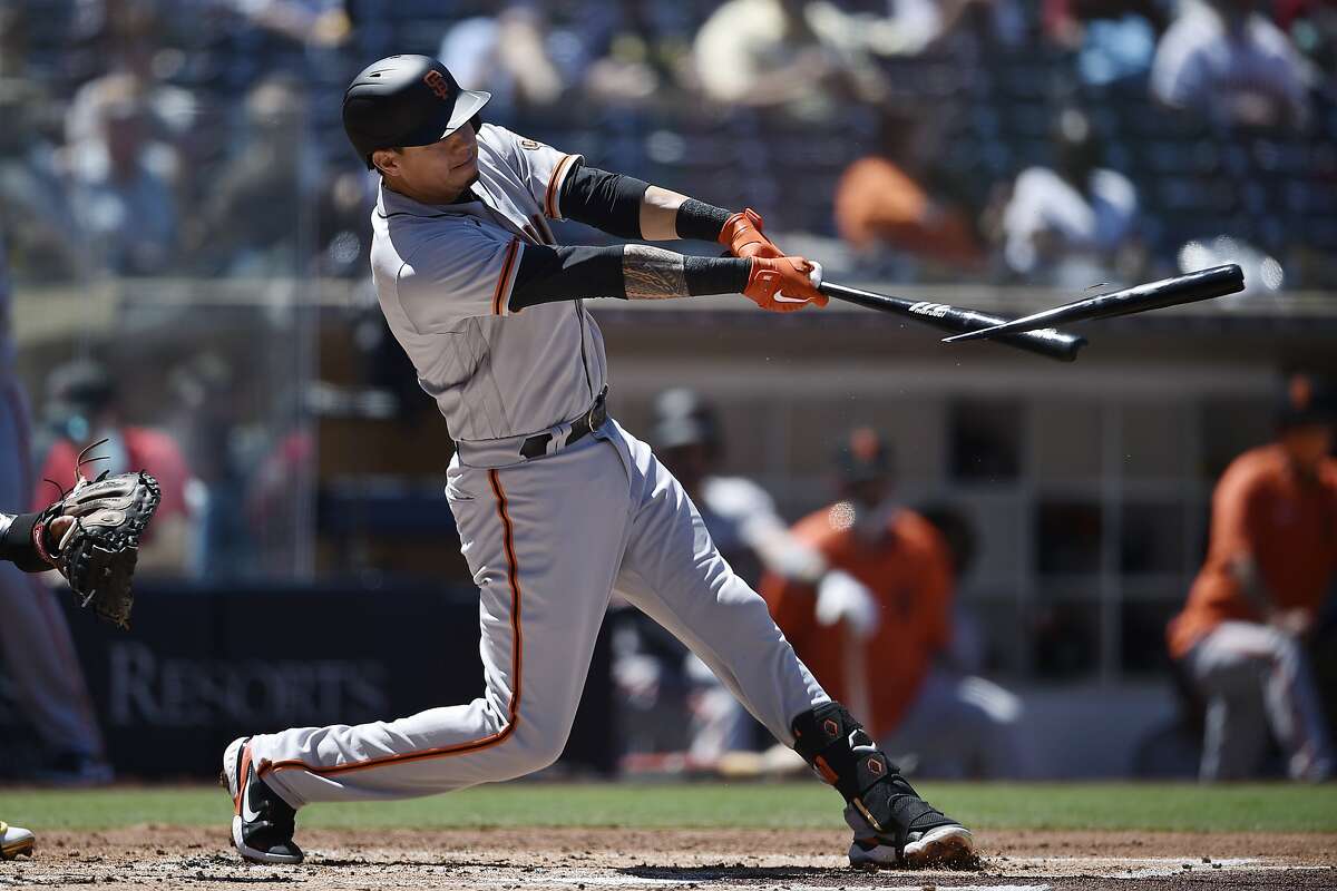 San Francisco Giants' Wilmer Flores breaks his bat on a hit during the second inning of the team's baseball game against the San Diego Padres in San Diego, Wednesday, April 7, 2021. (AP Photo/Kelvin Kuo)