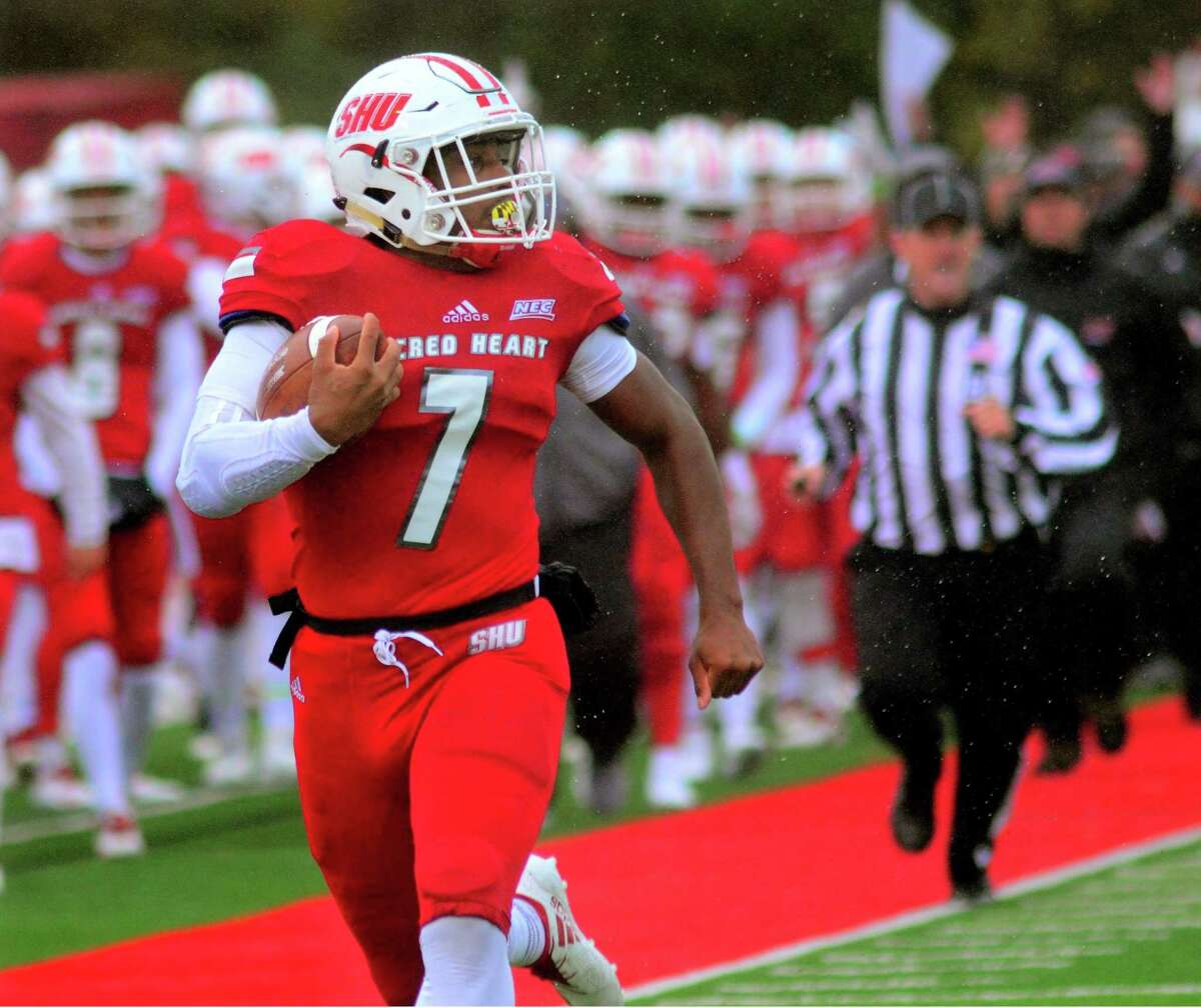 Sacred Heart University's Julius Chestnut (7) heads to the end zone to score a touchdown during college football action against Bryant in Fairfield, Conn. on Saturday Oct. 27, 2018.
