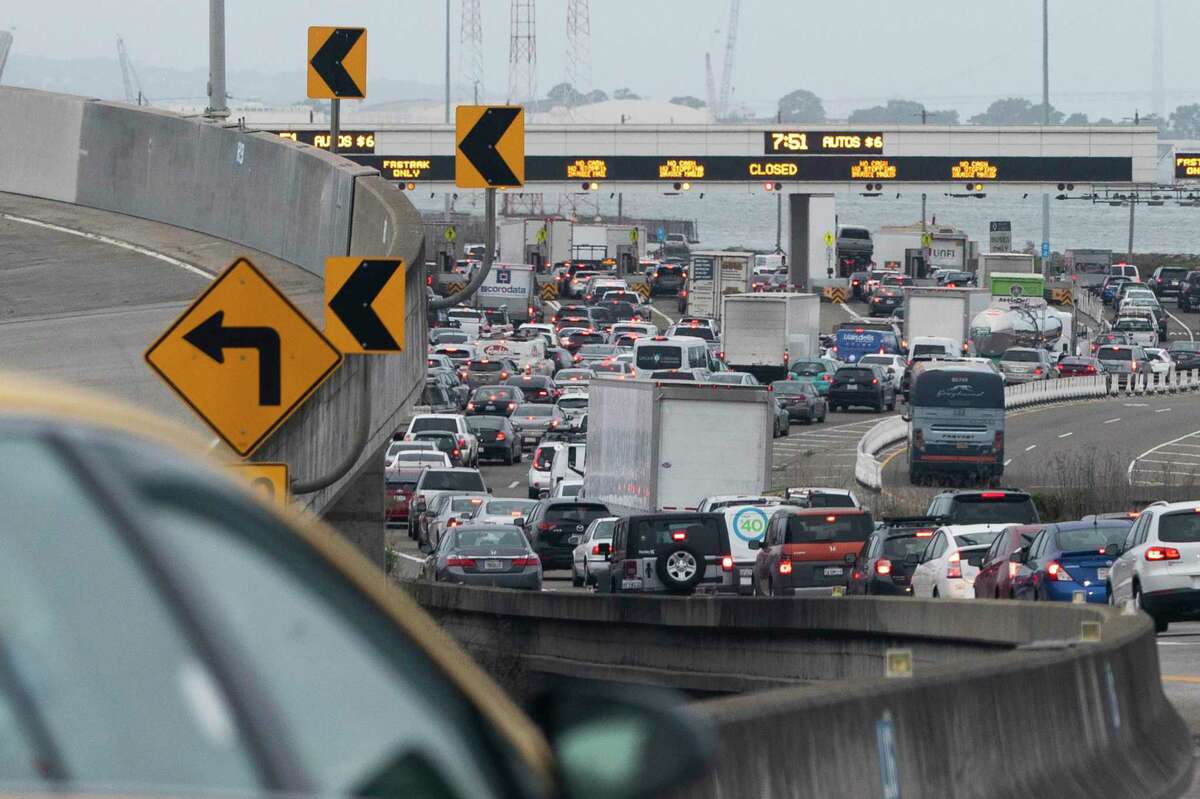 Traffic backs up at the toll plaza along Interstate 80 westbound in Emeryville as morning commuters make their way into San Francisco. An ambitious plan to make the Bay Area a more equitable place by 2050 calls for fixing bottlenecks such as this.