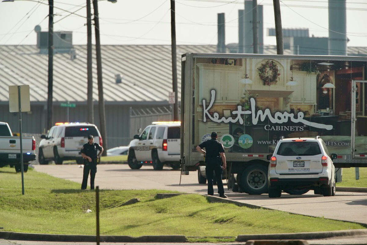 Police block off a road leading to the scene of a shooting at Kent Moore Cabinets on Thursday, April 8, 2021, in Bryan. At least one person is reported dead, and six people were hospitalized.