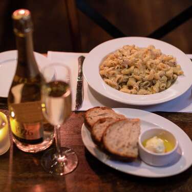 The "flaming mac and cheese," an off-menu specialty item ($25) at BALLO, is prepared tableside in an 80-pound wheel of authentic Italian Grana Padano, and topped with real, freshly-shaved black truffle. Chefs use grain alcohol to light the wheel and melt the cheese.