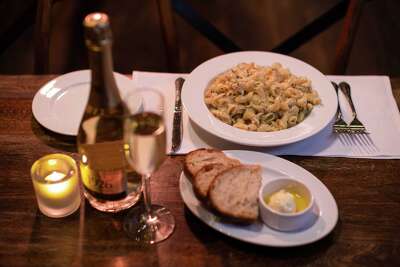 The "flaming mac and cheese," an off-menu specialty item ($25) at BALLO, is prepared tableside in an 80-pound wheel of authentic Italian Grana Padano, and topped with real, freshly-shaved black truffle. Chefs use grain alcohol to light the wheel and melt the cheese.