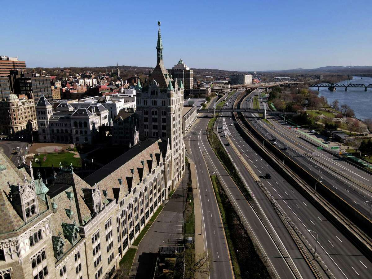  State University of New York campuses will require COVID-19 vaccinations for students starting in the fall semester. College students in the state are already required to prove vaccination against measles, mumps and rubella. Pictured: I-787 and the former Delaware & Hudson Building, now SUNY Plaza, is seen from above Frontage Road on Friday, April 9, 2021, in Albany, N.Y. (Will Waldron/Times Union)