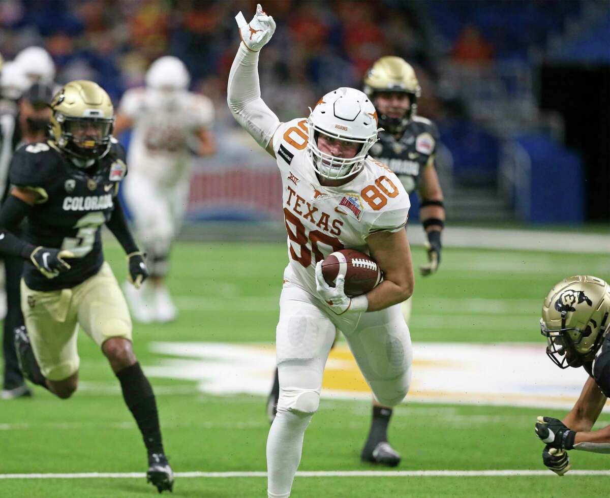 Longhorn tight end Cade Brewer recovers his balance after a catch downfield as Texas plays Colorado in the Alamo Bowl at the Alamodome on Dec. 29, 2020.