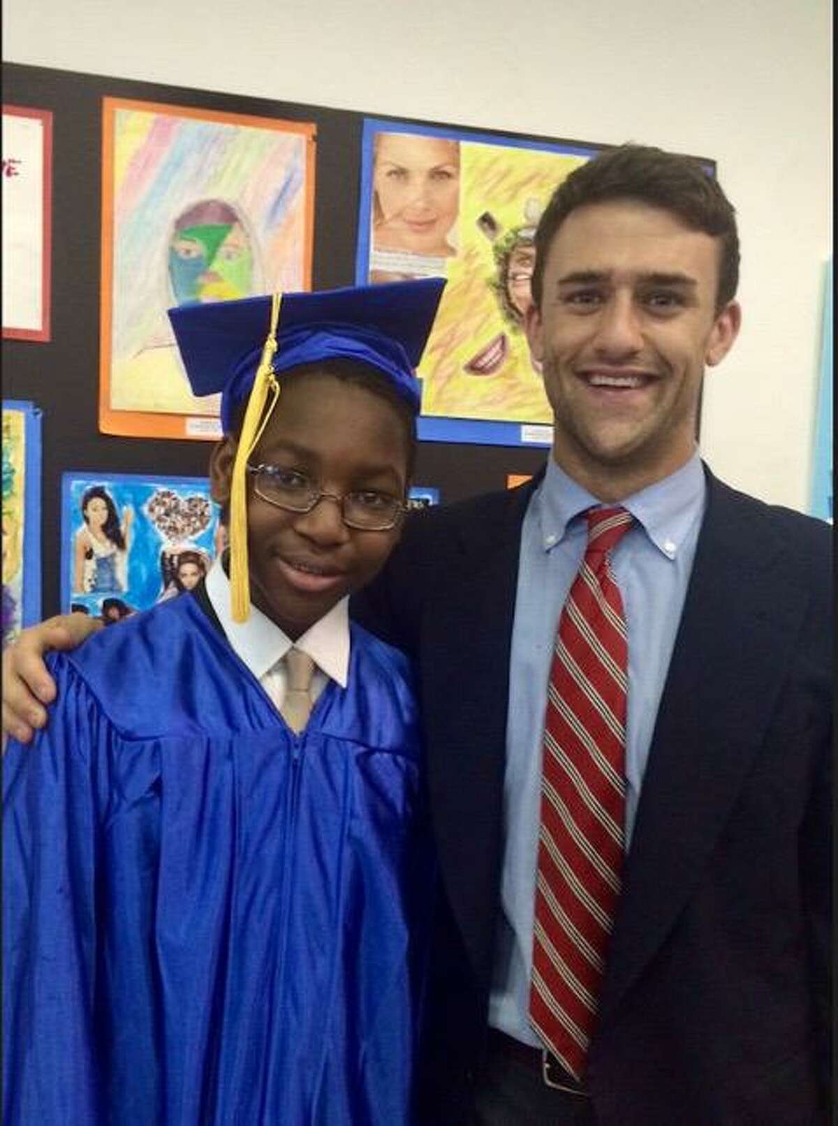 Nick Simmons, pictured here with former student Ismael Sy Savone, was selected by the administration of President Joe Biden to serve as a senior adviser to Education Secretary Miguel Cardona.
