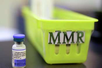 FILE - This Feb. 6, 2015, file photo shows a Measles, Mumps and Rubella, M-M-R vaccine on a countertop at a pediatrics clinic in Greenbrae, Calif. (AP Photo/Eric Risberg, File)