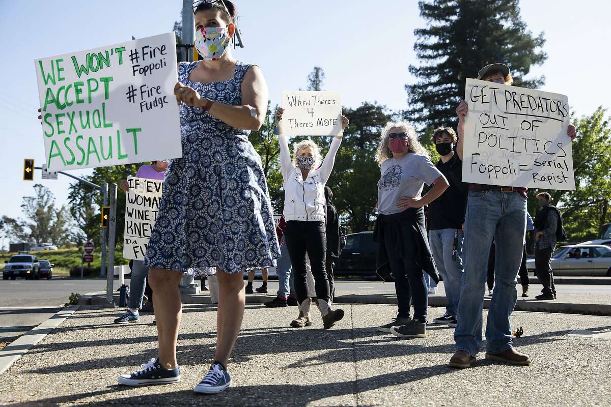 Sonoma County residents gathered on the corner of Lakewood Drive and Old Redwood Highway in Windsor on Friday to protest against Windsor Mayor Dominic Foppoli.