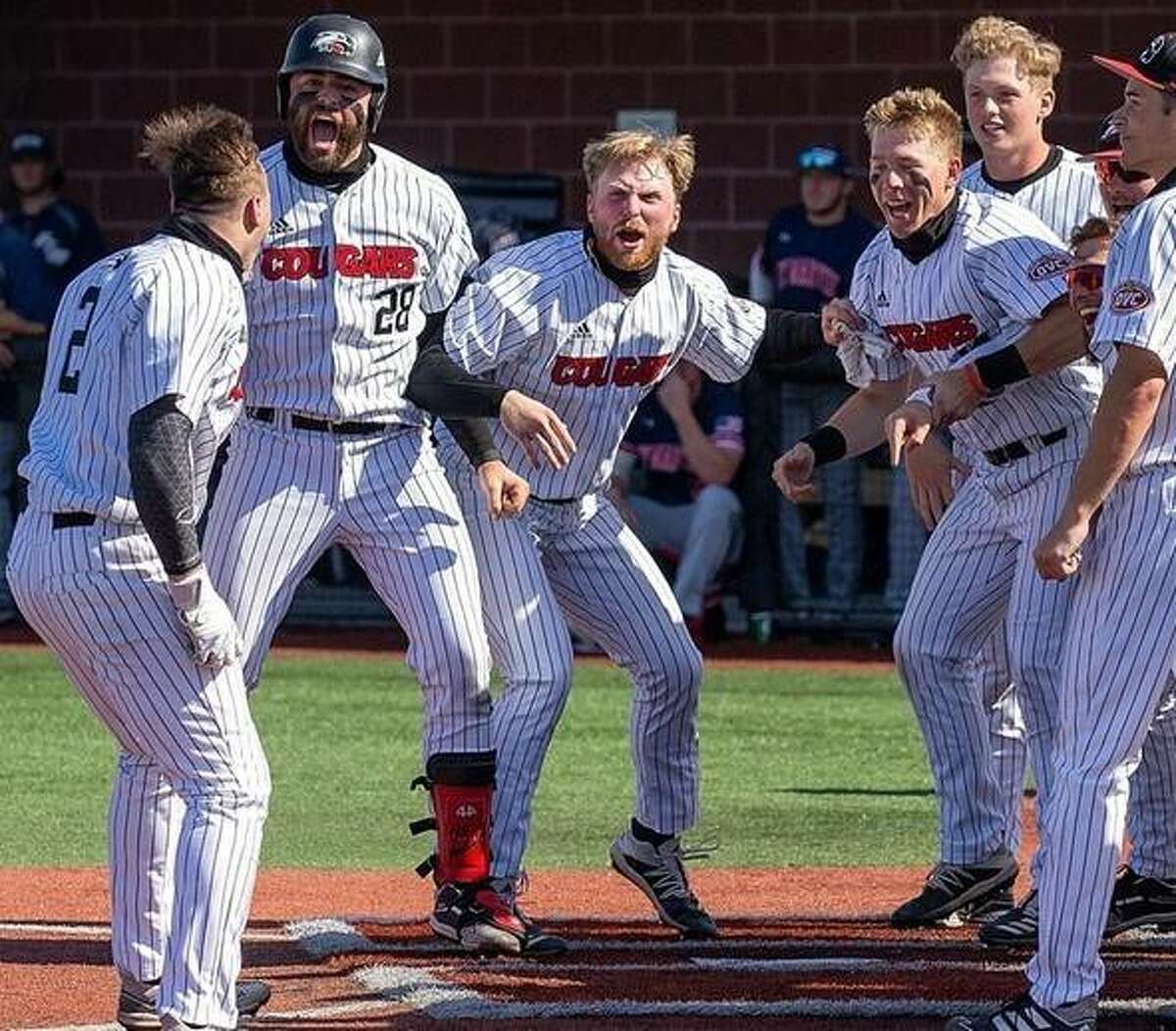 SIUE’s Brady Bunten, center, gets set to touch home after his walk-off homer in the 10th inning of the first game of a doubleheader sweep of UT Martin Friday at SIUE.