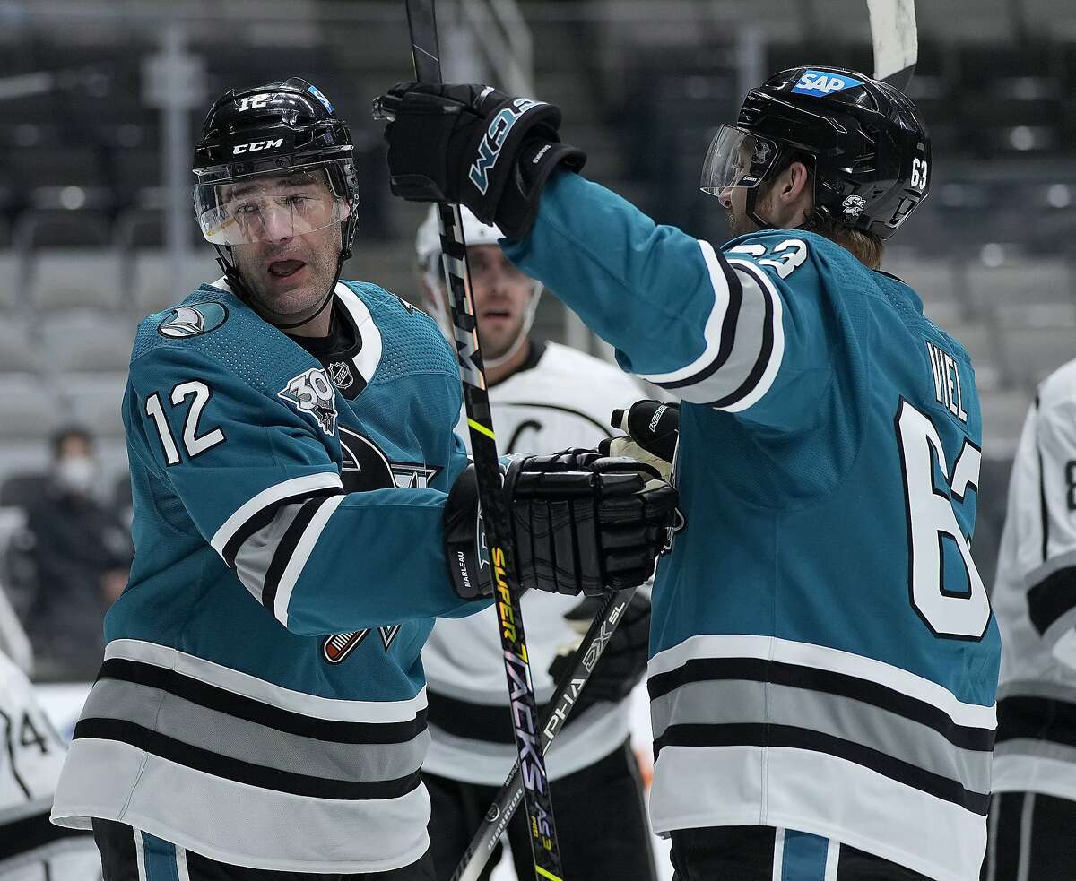 Sharks center Patrick Marleau (12) celebrates with Jeffrey Viel (63) after scoring against the Kings during the first period Friday.