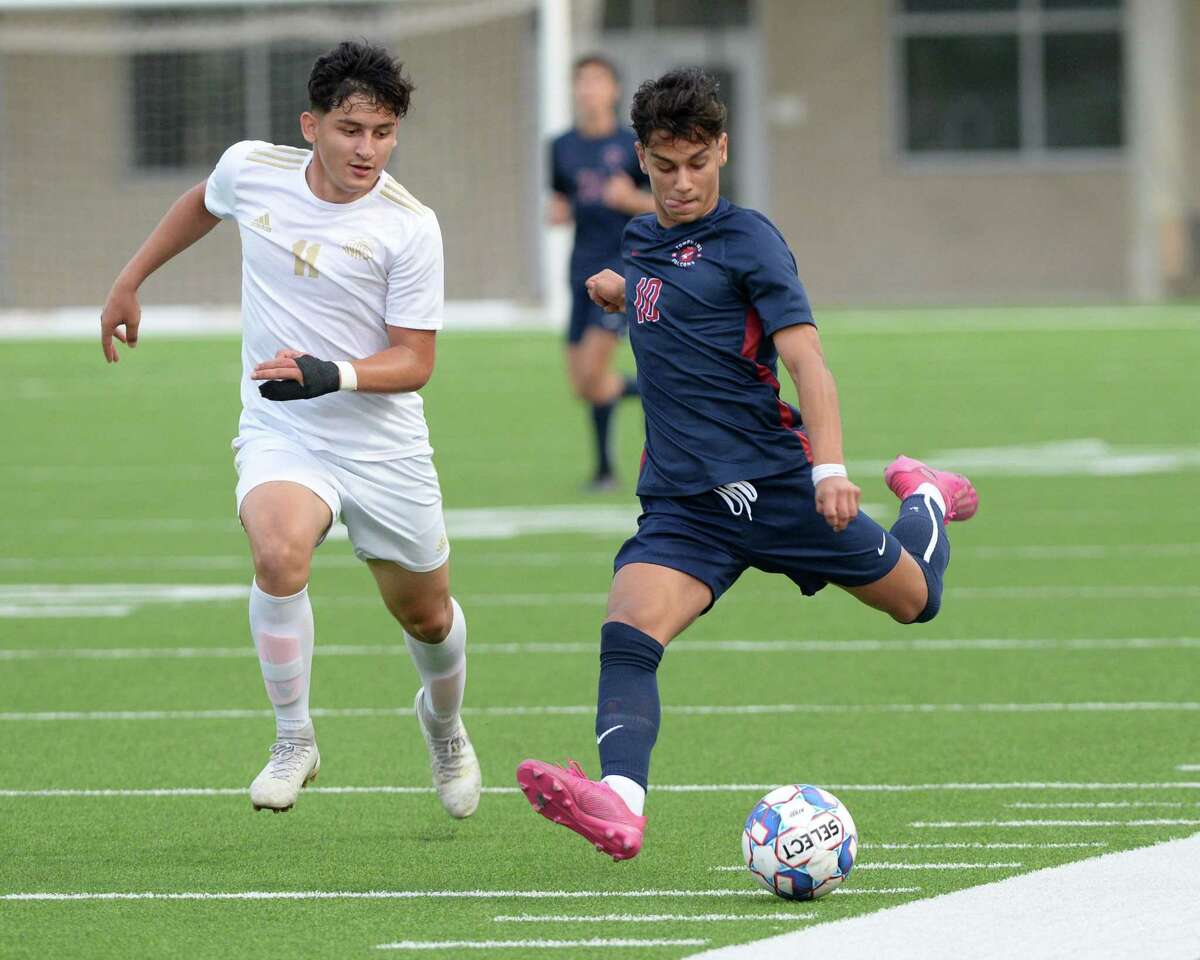 Luis Lugo (10) of Tompkins passes around Santiago Munoz (11) of Jersey Village during the first half of the region 6A-III soccer championship between the Tompkins Falcons and the Jersey Village Falcons on Friday, April 9, 2021 at Legacy Stadium, Katy, TX.