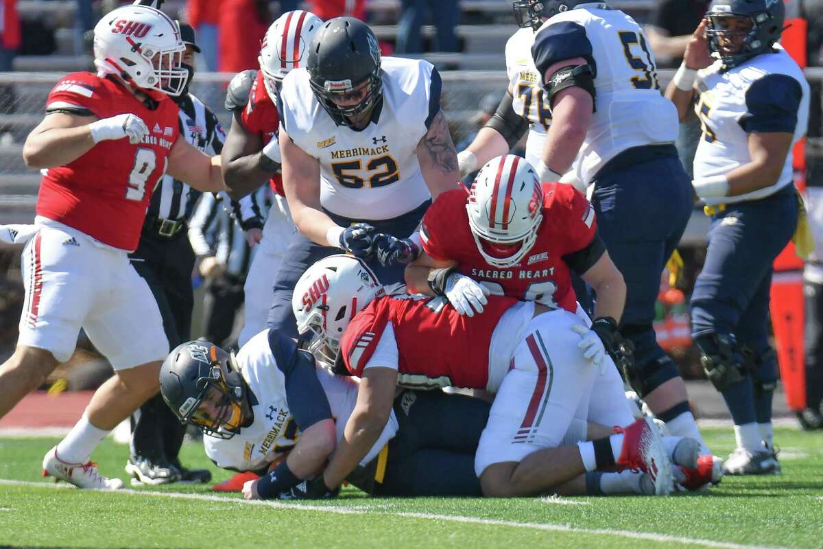 The Sacred Heart defense makes a tackle during a 26-9 win over Merrimack in March in Fairfield.