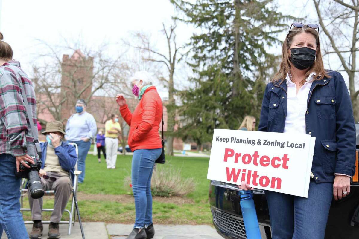 Kim Healy, of Wilton, makes her voice heard at a rally at Town Hall organized by CT 169 Strong on Saturday, April 10, 2021, Fairfield, Conn.