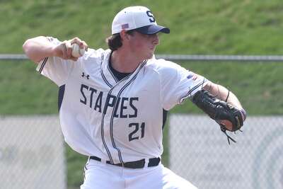 Staples' Carter Kelsey fires in a pitch against Darien in Westport on Saturday. Kelsey and Matt Spada combined on a no-hitter.