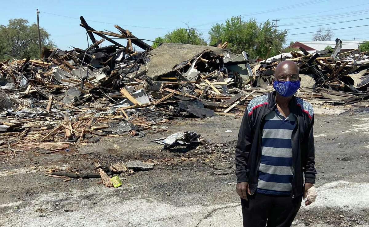 Rev. Johnnie Guyton, 79, stands in front of the charred rubble that’s all that remains of his East Side church Saturday, April 10, 2021. Huntleigh Park Baptist Church caught fire late Friday night, but the blaze swept through the largely wooden structure so quickly, it was totally destroyed before firefighters could extinguish it. No injuries were reported.