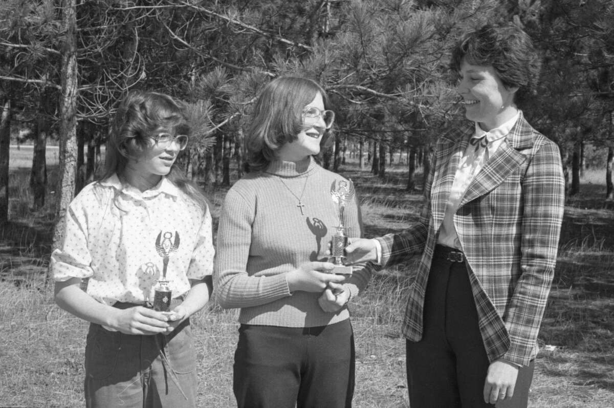 Kaleva Norman Dickson Schools took first and second place honors at a spelling bee held at Baldwin High School last Tuesday. Cindy Asiala, right, eighth grade English instructor at the school, presents a first-place trophy to Anne Hooghart, while Kristy Lancaster holds her second place award. The photo was published in the News Advocate in early April of 1981. (Manistee County Historical Museum photo)