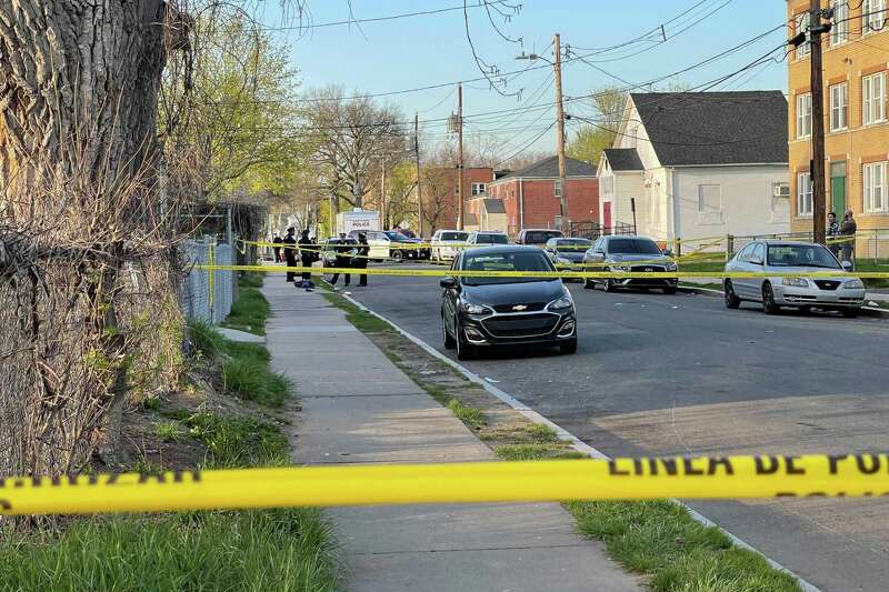 Hartford police officers and detectives gathered at the scene of a shooting on Magnolia Street Saturday. Jamari Preston, 16, of New Britain was killed in the shooting.